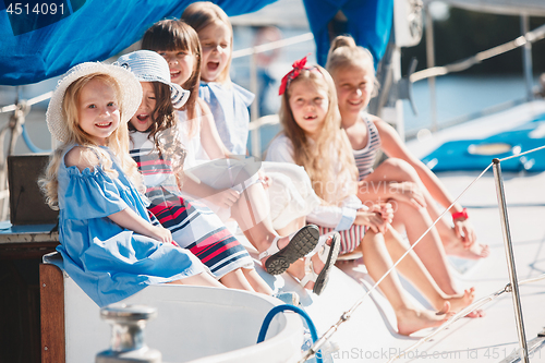 Image of The children on board of sea yacht