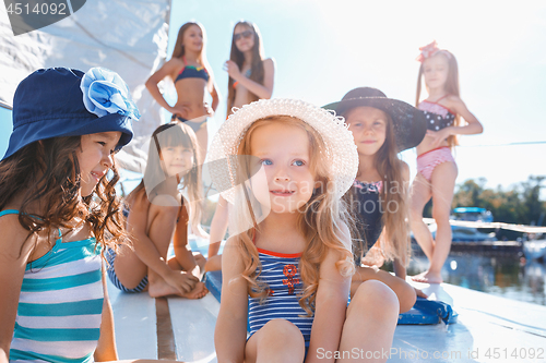 Image of The children on board of sea yacht