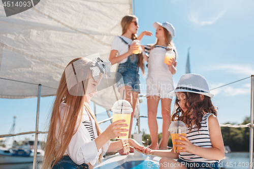 Image of The children on board of sea yacht