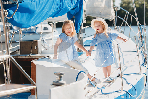 Image of The children on board of sea yacht