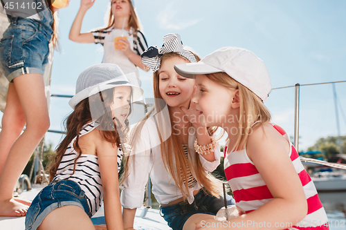 Image of The children on board of sea yacht