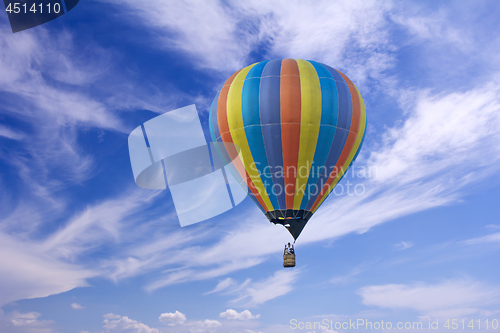 Image of Colorful hot-air balloon flying in the blue sky