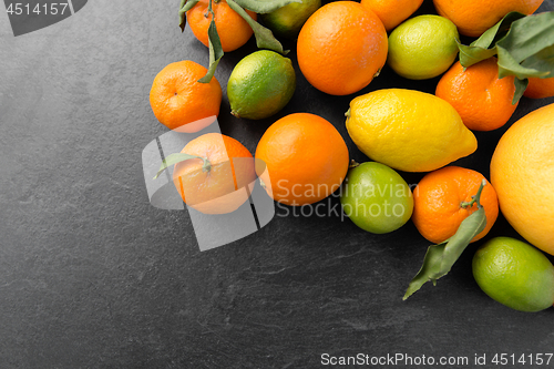 Image of close up of citrus fruits on stone table