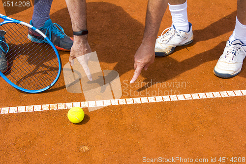 Image of Tennis players shows the track on the tennis court