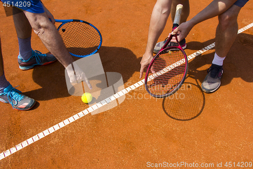 Image of Tennis players shows the track on the tennis court