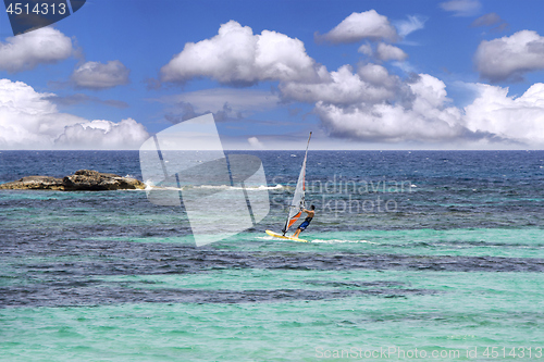 Image of Windsurfing on sea and blue sky background