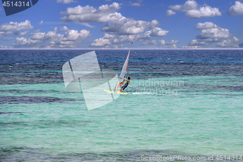 Image of Windsurfing on sea and blue sky background