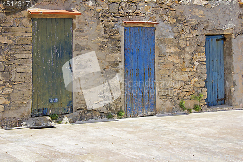 Image of Colorful old wooden doors in Formentera near Ibiza