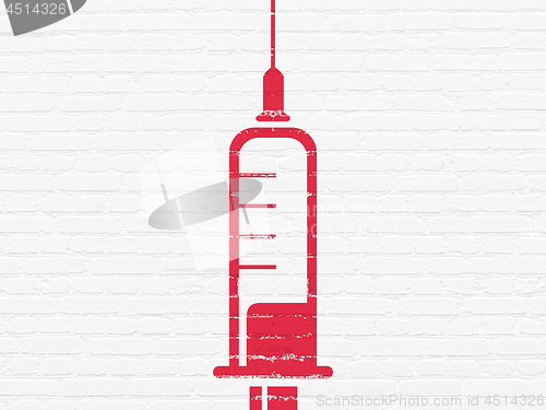 Image of Healthcare concept: Syringe on wall background