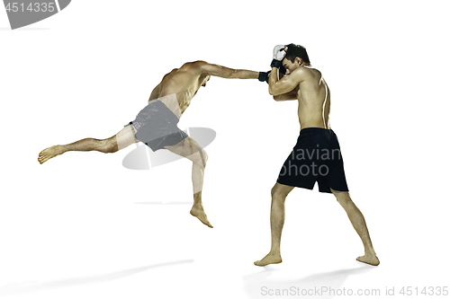 Image of Two professional boxer boxing isolated on white studio background