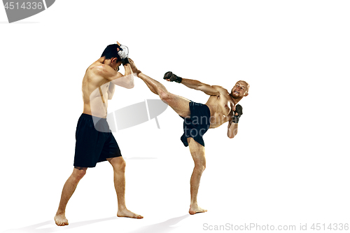 Image of Two professional boxer boxing isolated on white studio background