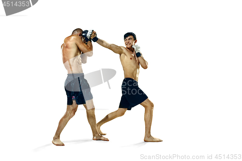 Image of Two professional boxer boxing isolated on white studio background