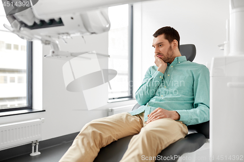 Image of patient suffering from toothache at dental clinic