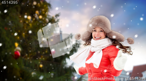 Image of happy woman over christmas tree in tallinn