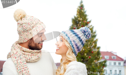 Image of happy couple over christmas tree in tallinn