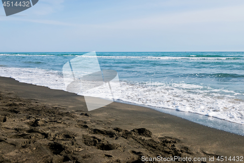 Image of Beautiful sea and the black sandy beach,