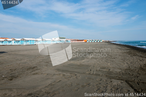 Image of Beautiful sea and the black sandy beach with beach houses