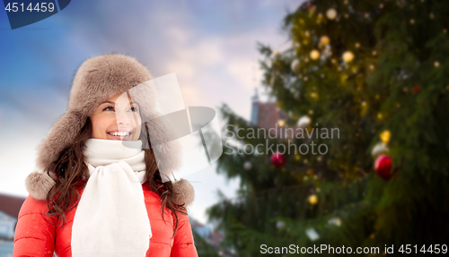 Image of happy woman over christmas tree in tallinn