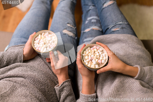 Image of close up of couple drinking hot chocolate at home