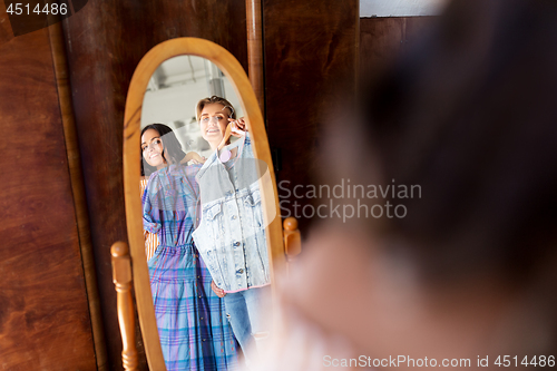 Image of women choosing clothes at vintage clothing store