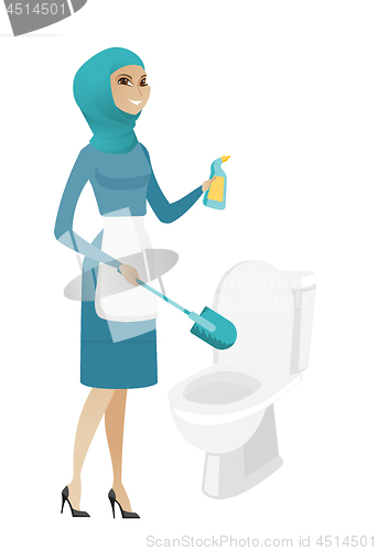 Image of Muslim cleaner in uniform cleaning toilet bowl.