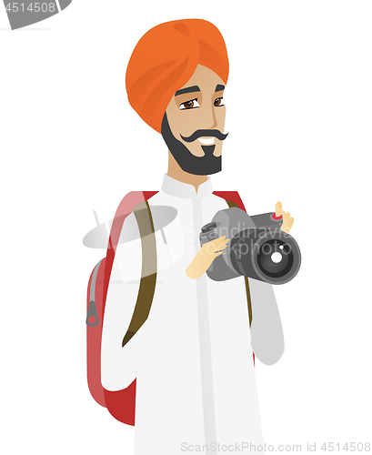 Image of Hindu nature photographer with digital camera.