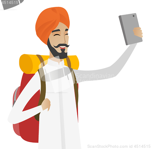 Image of Hindu traveler man with backpack making selfie.