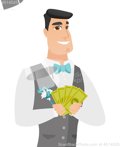 Image of Young caucasian groom holding money.