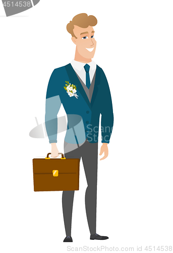 Image of Caucasian groom holding briefcase.