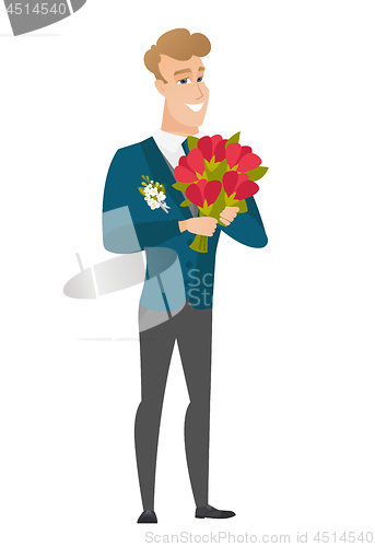 Image of Caucasian groom holding a bouquet of flowers