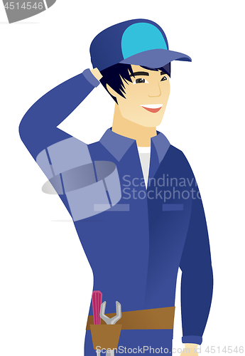 Image of Young asian mechanic laughing.