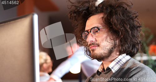 Image of businessman working using a computer in startup office