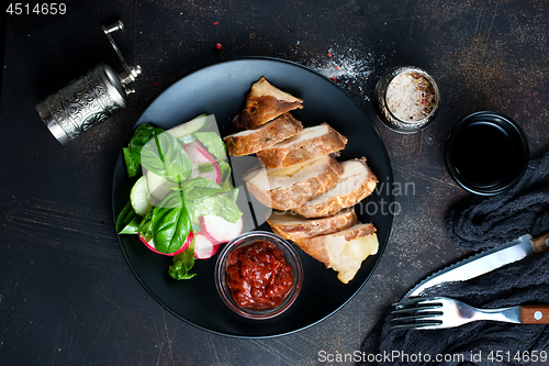 Image of meat with salad