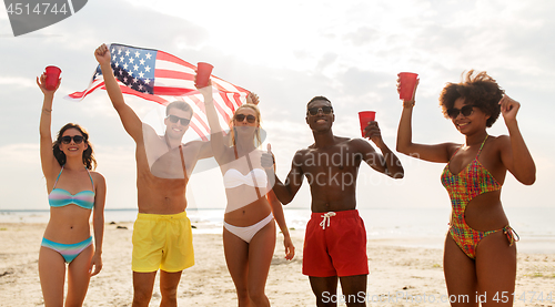 Image of friends at american independence day beach party