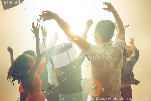 Image of Nightlife and disco concept. Young people are dancing in club.