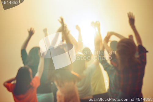 Image of Nightlife and disco concept. Young people are dancing in club.