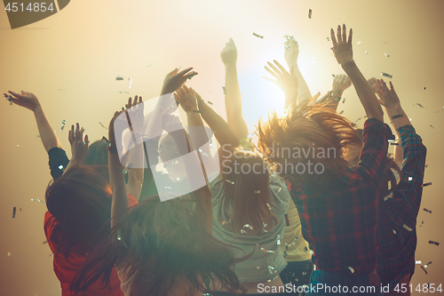 Image of Nightlife and disco concept. Young people are dancing in club.