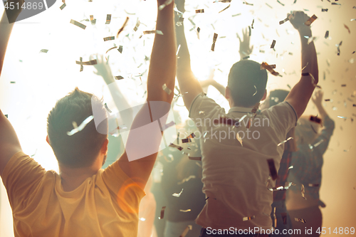 Image of Nightlife and disco concept. Young people are dancing in club.