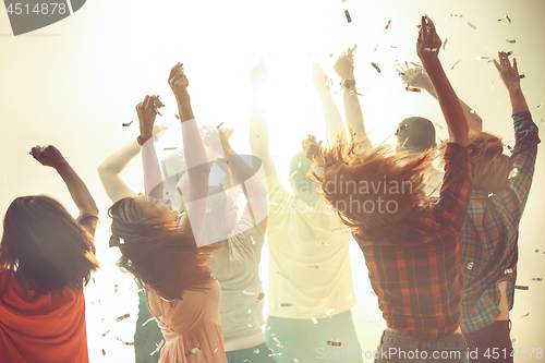 Image of Nightlife and disco concept. Young people are dancing in club.