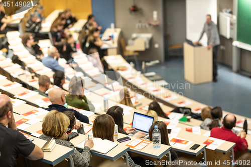 Image of Expert speaker giving a talk at scientific business conference event.