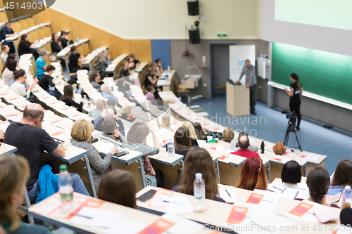 Image of Expert speaker giving a talk at scientific business conference event.