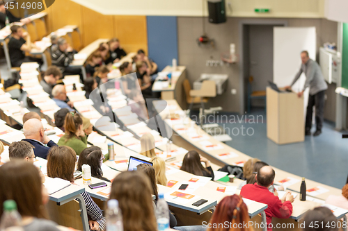 Image of Expert speaker giving a talk at scientific business conference event.