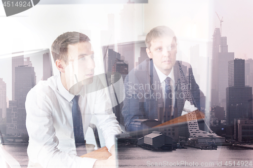 Image of Business team analyzing data at business meeting in corporate office in new york city.