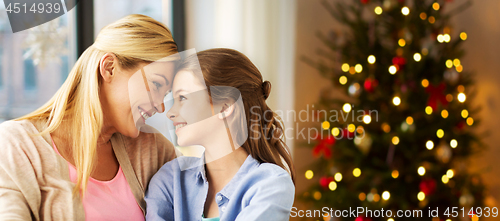 Image of happy family of mother and daughter on christmas