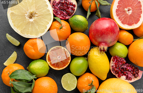 Image of close up of citrus fruits on stone table