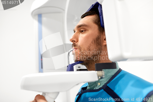 Image of patient having x-ray scanning at dental clinic