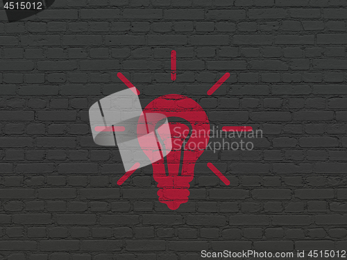 Image of Business concept: Light Bulb on wall background