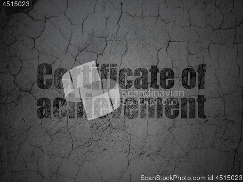 Image of Learning concept: Certificate of Achievement on grunge wall background