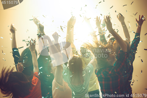 Image of Nightlife and disco concept. Young people are dancing in club.