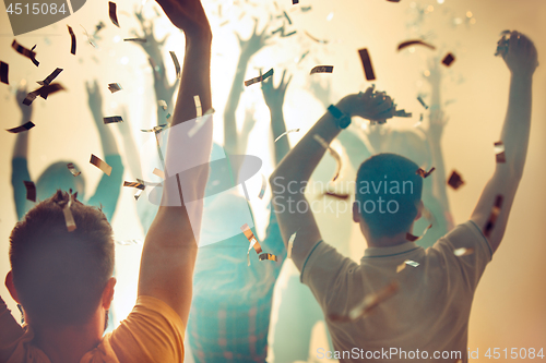 Image of Nightlife and disco concept. Young people are dancing in club.